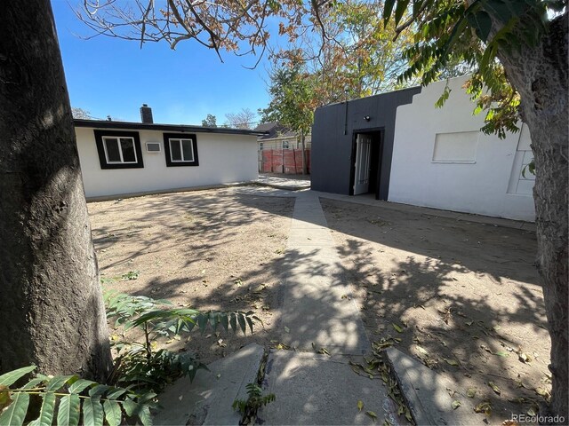 rear view of house featuring a patio