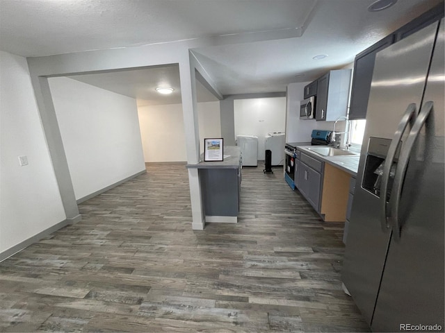 kitchen featuring dark hardwood / wood-style flooring and appliances with stainless steel finishes