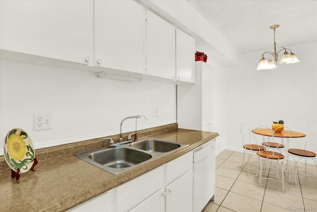 10211 Ura Ln Unit 101, Thornton, CO 80260 - kitchen with white dishwasher, white cabinets, light tile patterned flooring, and decorative light fixtures