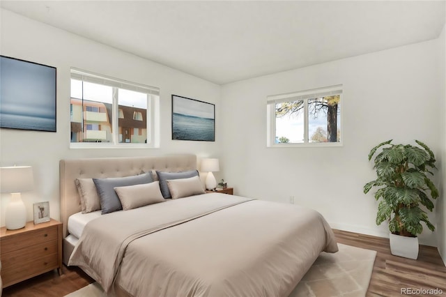 10211 Ura Ln Unit 101, Thornton, CO 80260 - bedroom featuring wood finished floors