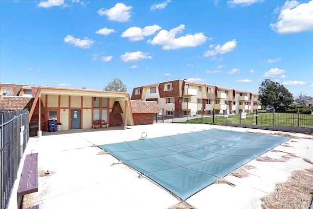 10211 Ura Ln Unit 101, Thornton, CO 80260 - view of swimming pool featuring a residential view and a patio