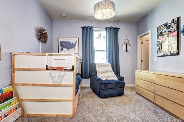 852 Kalamath St, Denver, CO 80204 - carpeted bedroom with a chandelier and baseboards