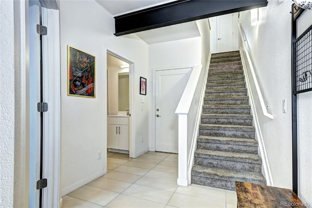 852 Kalamath St, Denver, CO 80204 - stairs featuring tile patterned floors and baseboards