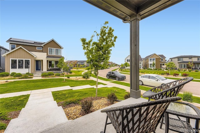 6211 Stable View St, Castle Pines, CO 80108 - porch featuring a lawn and a residential view