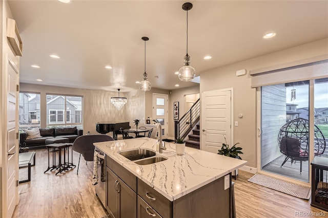 6211 Stable View St, Castle Pines, CO 80108 - kitchen featuring open floor plan, light wood-style flooring, plenty of natural light, and recessed lighting