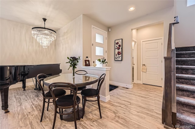 6211 Stable View St, Castle Pines, CO 80108 - dining room with stairway, wood finished floors, a chandelier, and recessed lighting
