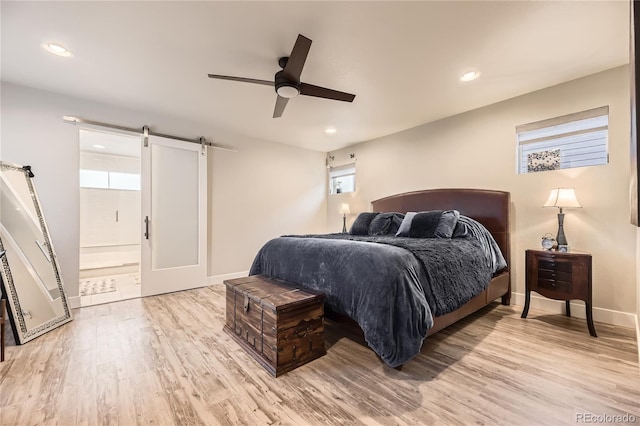6211 Stable View St, Castle Pines, CO 80108 - bedroom featuring a barn door, light wood-style flooring, recessed lighting, and a ceiling fan