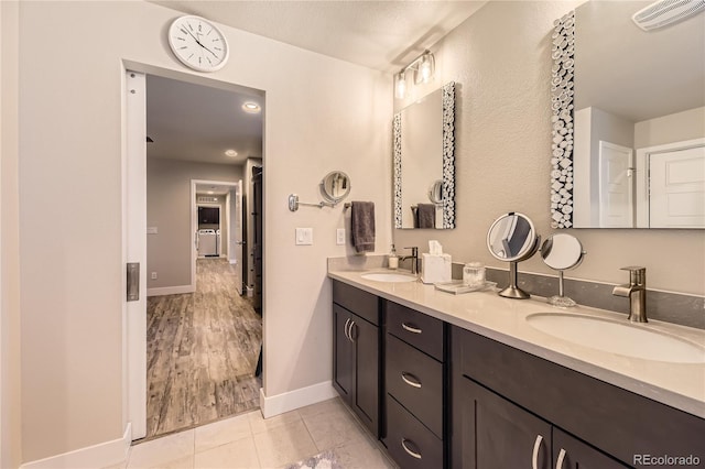6211 Stable View St, Castle Pines, CO 80108 - bathroom with double vanity and tile patterned flooring