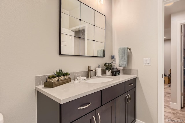 6211 Stable View St, Castle Pines, CO 80108 - bathroom with vanity and wood finished floors
