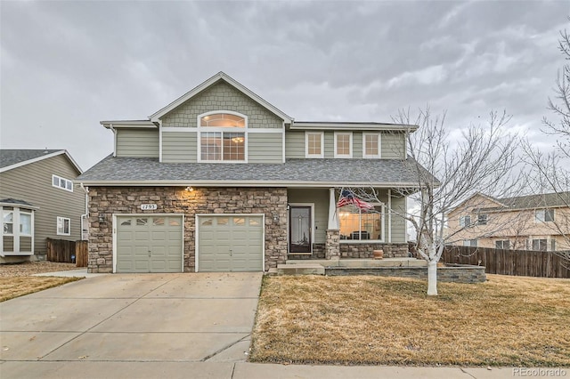 view of front of property with roof with shingles, a porch, concrete driveway, an attached garage, and fence