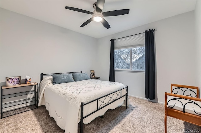 bedroom featuring a ceiling fan, carpet, and baseboards