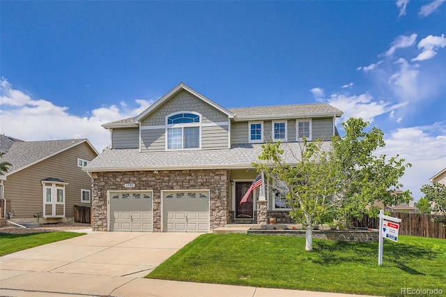 1793 E 164th Pl, Thornton, CO 80602 - view of front of house with a garage, concrete driveway, stone siding, and roof with shingles