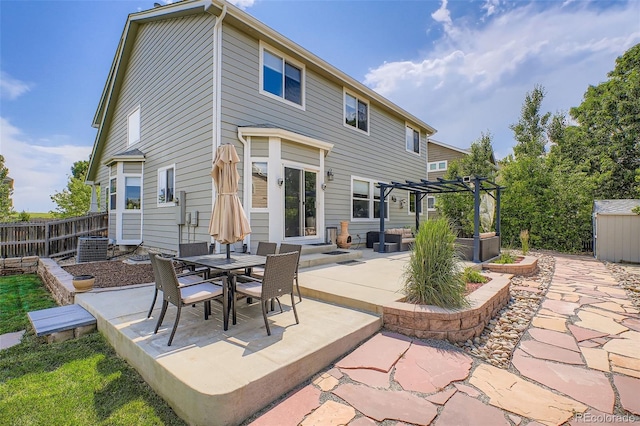 1793 E 164th Pl, Thornton, CO 80602 - view of patio / terrace with a pergola, outdoor dining space, and an outdoor structure