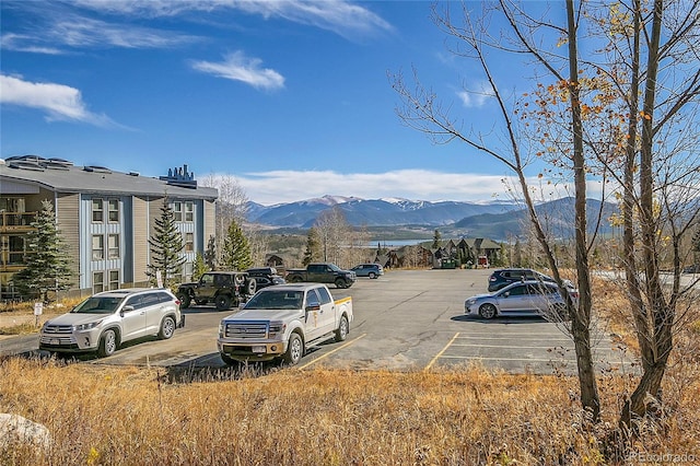 view of parking / parking lot featuring a mountain view