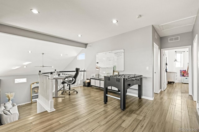 game room featuring vaulted ceiling with beams, light hardwood / wood-style floors, and ceiling fan