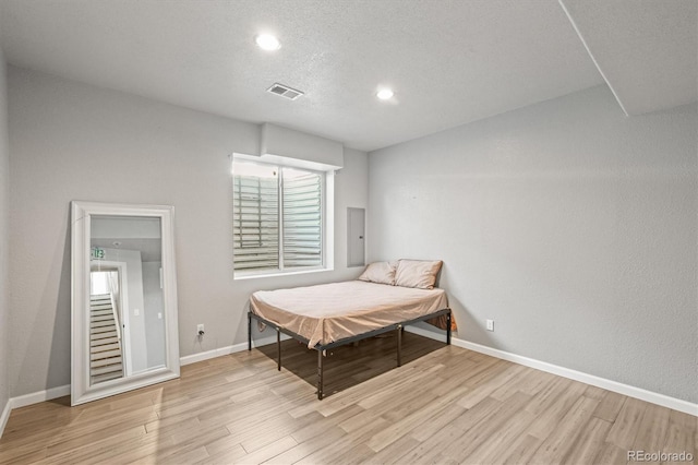 bedroom with light hardwood / wood-style flooring