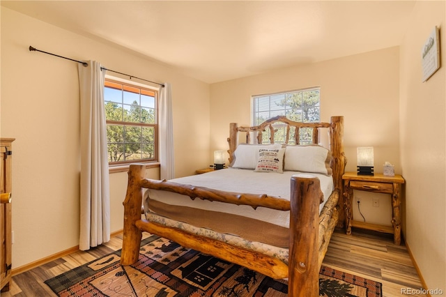 bedroom with light wood-type flooring