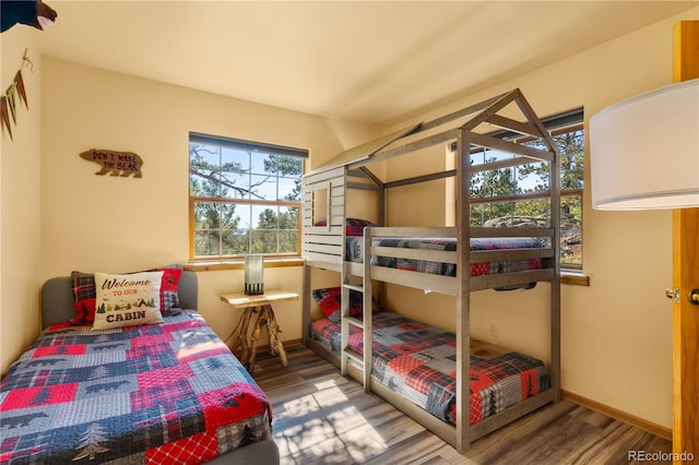 bedroom with hardwood / wood-style flooring