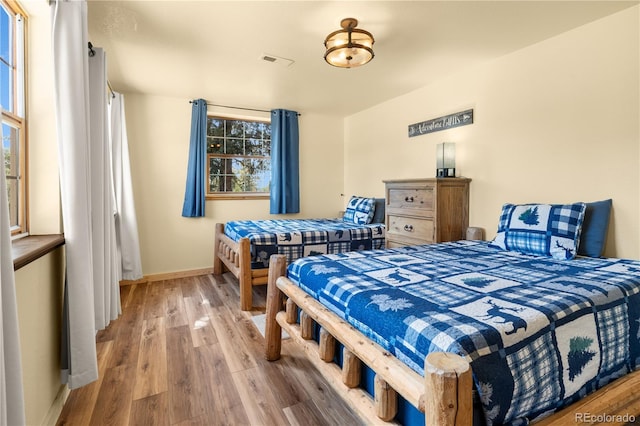 bedroom featuring hardwood / wood-style flooring