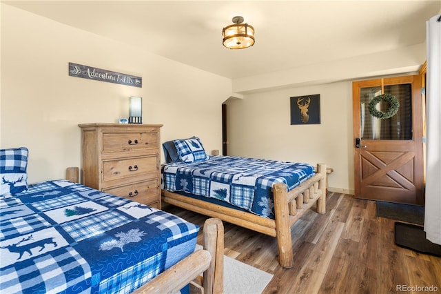 bedroom featuring wood-type flooring