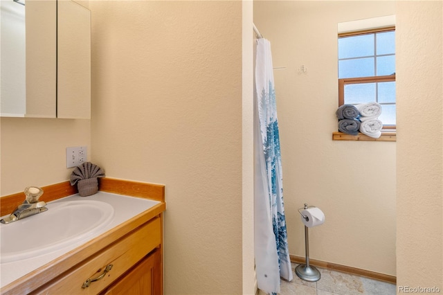 bathroom featuring vanity and tile patterned flooring