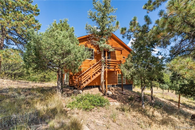 view of front of house with a wooden deck