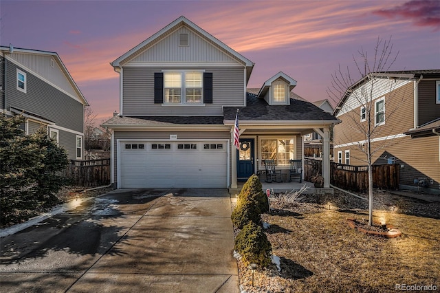 front of property with a garage and a porch