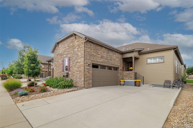3418 New Haven Cir, Castle Rock, CO 80109 - view of front facade featuring stone siding, concrete driveway, and an attached garage