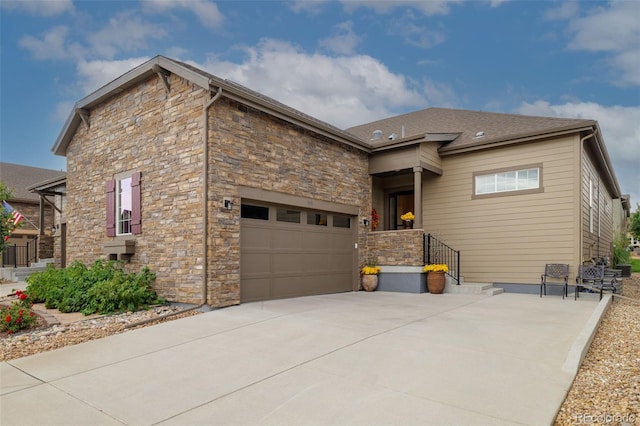 3418 New Haven Cir, Castle Rock, CO 80109 - view of front of house featuring stone siding, concrete driveway, and a garage