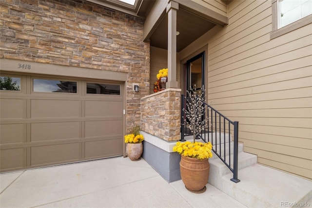 3418 New Haven Cir, Castle Rock, CO 80109 - entrance to property with stone siding, driveway, and a garage