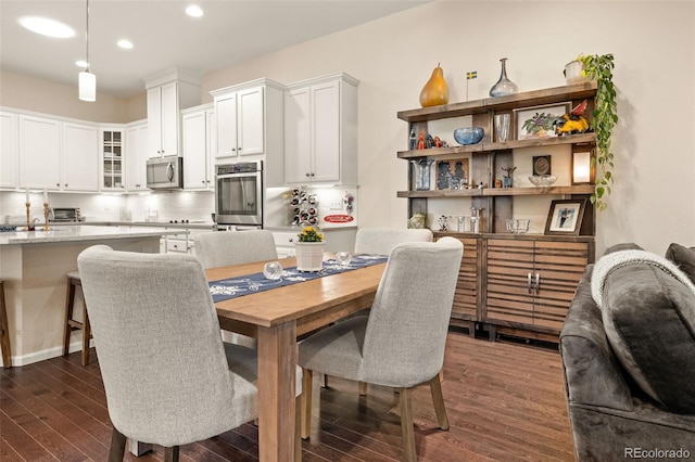 3418 New Haven Cir, Castle Rock, CO 80109 - dining space with dark wood-style flooring and recessed lighting
