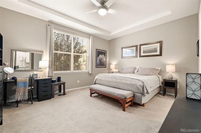 3418 New Haven Cir, Castle Rock, CO 80109 - bedroom with a tray ceiling, baseboards, light colored carpet, and a ceiling fan