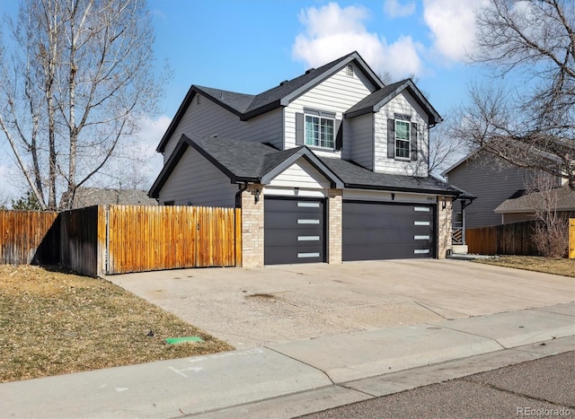 view of front of property featuring an attached garage, fence, concrete driveway, and brick siding