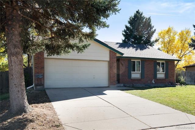 single story home featuring a front yard and a garage