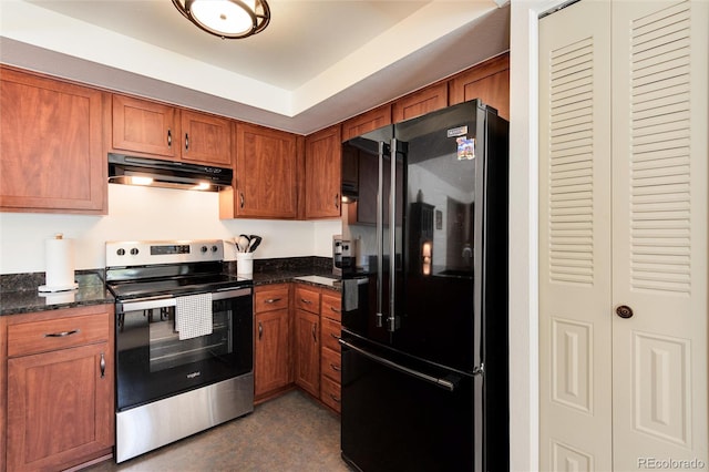 kitchen featuring stainless steel electric range, dark stone countertops, and black refrigerator