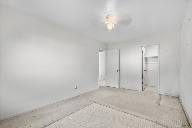 10463 Kipling Ct, Broomfield, CO 80021 - unfurnished bedroom featuring carpet, a closet, a ceiling fan, and a spacious closet