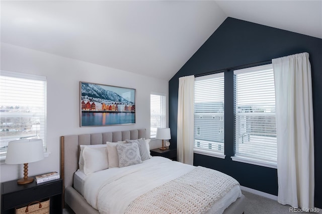 bedroom featuring carpet floors, vaulted ceiling, and baseboards