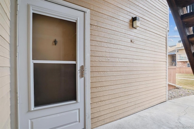 property entrance with fence