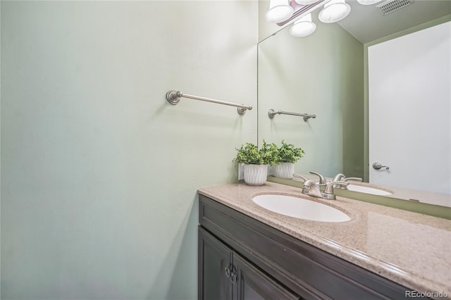 bathroom with visible vents and vanity