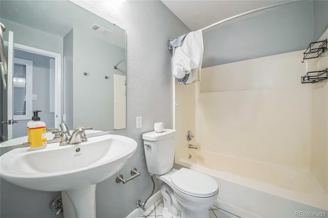 bathroom featuring a sink, toilet, shower / tub combination, and visible vents