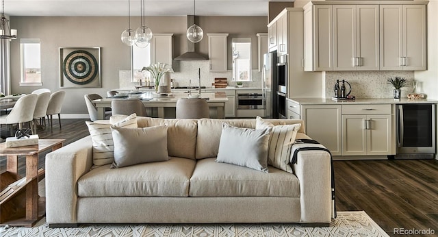 living room featuring beverage cooler and dark hardwood / wood-style flooring