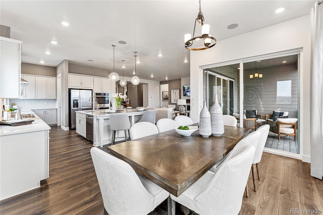 dining space featuring dark wood-type flooring