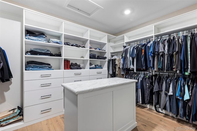 spacious closet featuring light hardwood / wood-style flooring