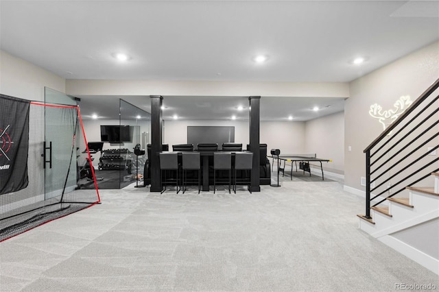 recreation room with light carpet