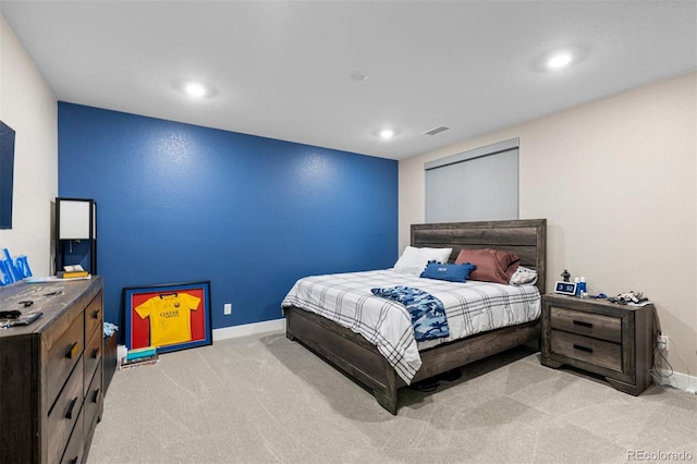 bedroom featuring light colored carpet