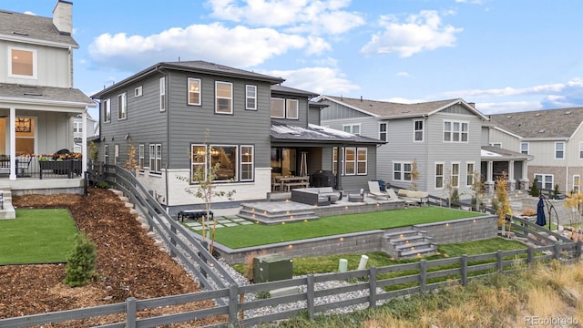 back of house featuring an outdoor hangout area and a wooden deck