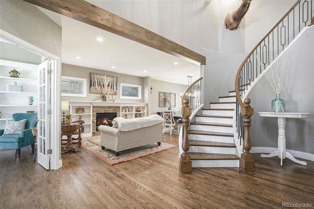 3002 S Oak Way, Lakewood, CO 80227 - living room with wood finished floors, stairs, a fireplace, recessed lighting, and baseboards