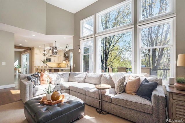 3002 S Oak Way, Lakewood, CO 80227 - living room with a high ceiling, wood finished floors, recessed lighting, and baseboards