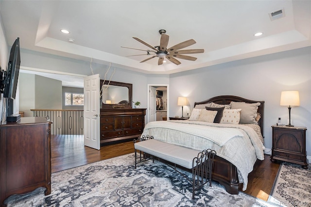 3002 S Oak Way, Lakewood, CO 80227 - bedroom featuring a raised ceiling, wood finished floors, ceiling fan, and recessed lighting