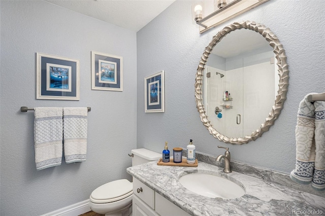 3002 S Oak Way, Lakewood, CO 80227 - full bathroom featuring toilet, vanity, and an enclosed shower